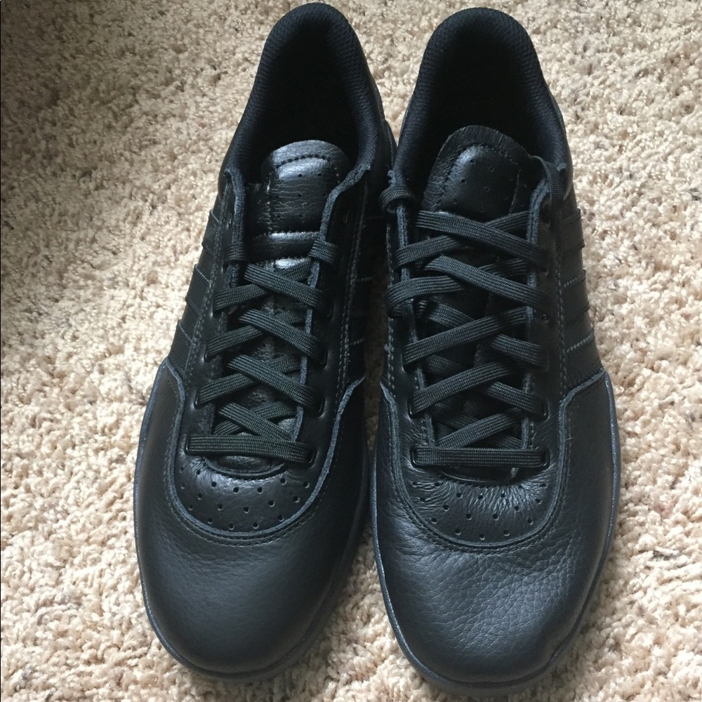 Black Adidas the brand with three stripes